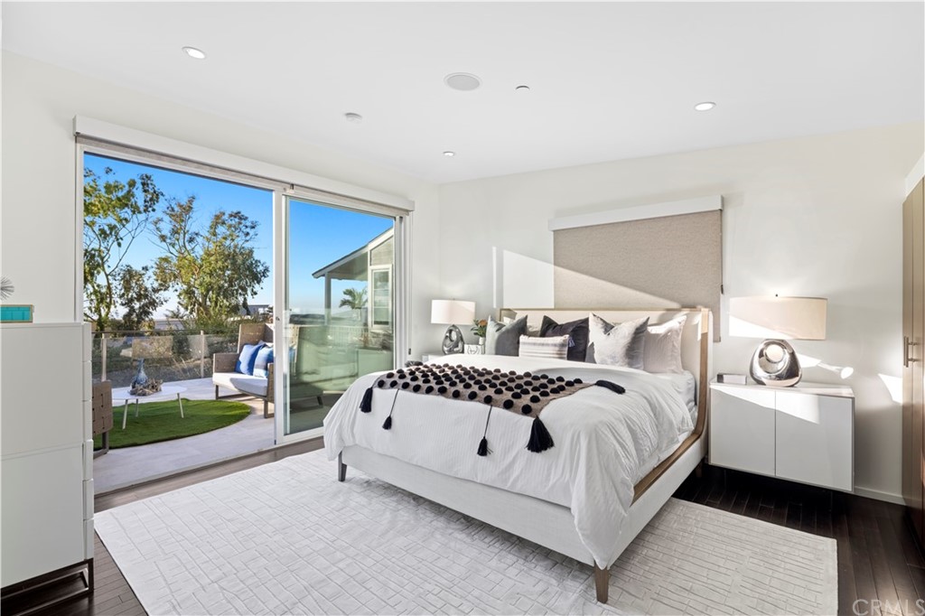 970 Baja Street Laguna Beach, CA 92651 - Photo 9 of 27 a bedroom with a large bed and a painting on the wall