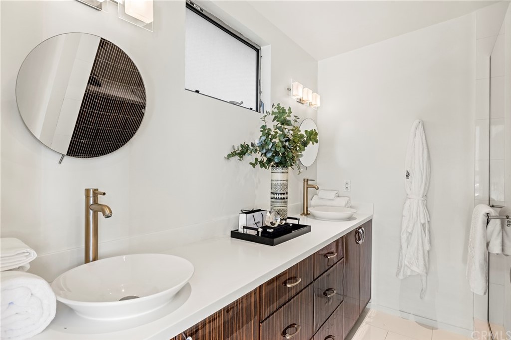 970 Baja Street Laguna Beach, CA 92651 - Photo 10 of 27 a bathroom with a sink toilet and mirror