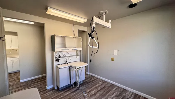 a room with a chair and a flat screen tv