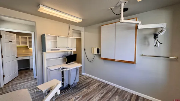 a white refrigerator freezer and a stove sitting inside of a kitchen