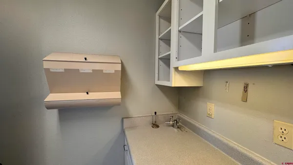 a view of a hallway with seating area