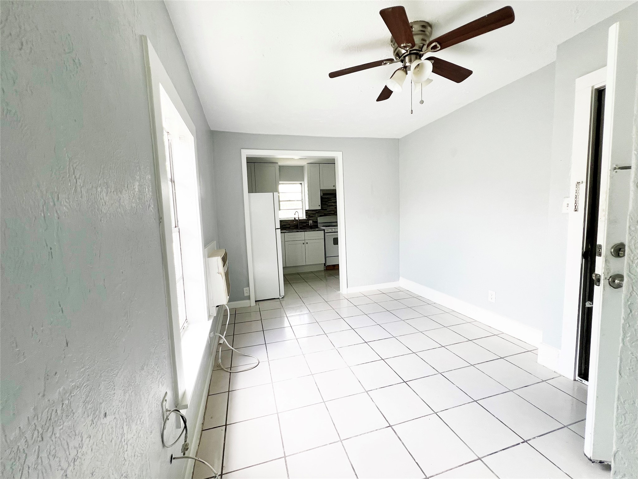 103 Cosmos Street, Unit 4 Houston, TX 77009 - Photo 2 of 8 a view of an empty room and window