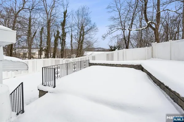 a view of snow on the side of a road