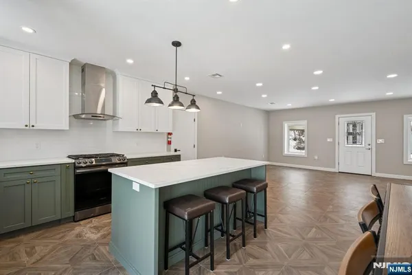 a kitchen with a sink stove and cabinets
