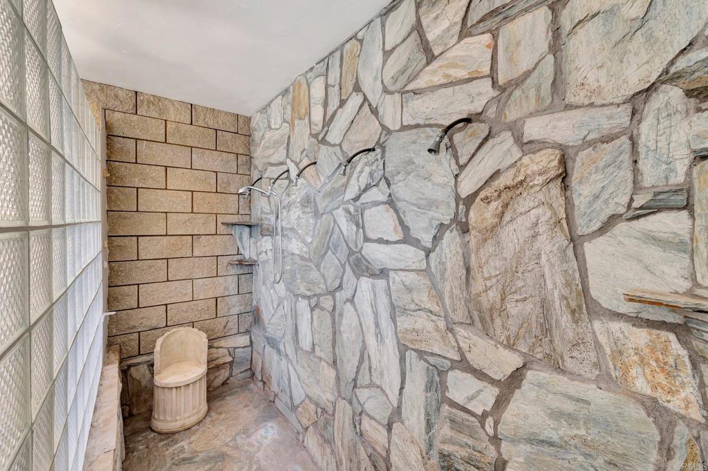 19105 Laminack Lane Jamul, CA 91935 - Photo 12 of 27 a bathroom with a toilet and a shower curtain
