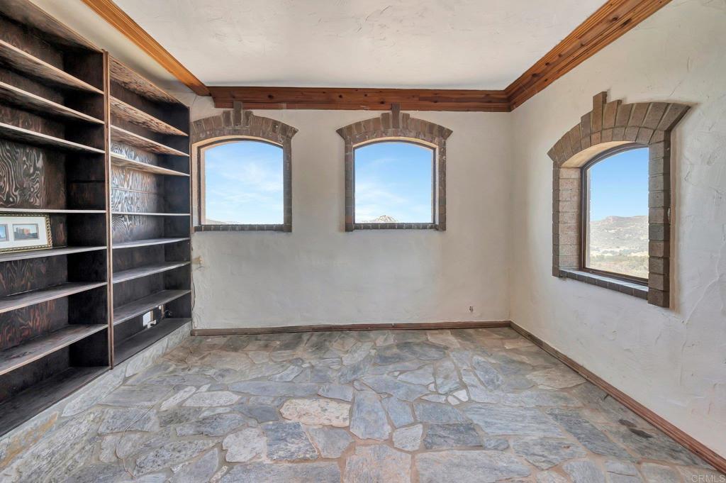 19105 Laminack Lane Jamul, CA 91935 - Photo 13 of 27 a view of empty room with cabinet and window