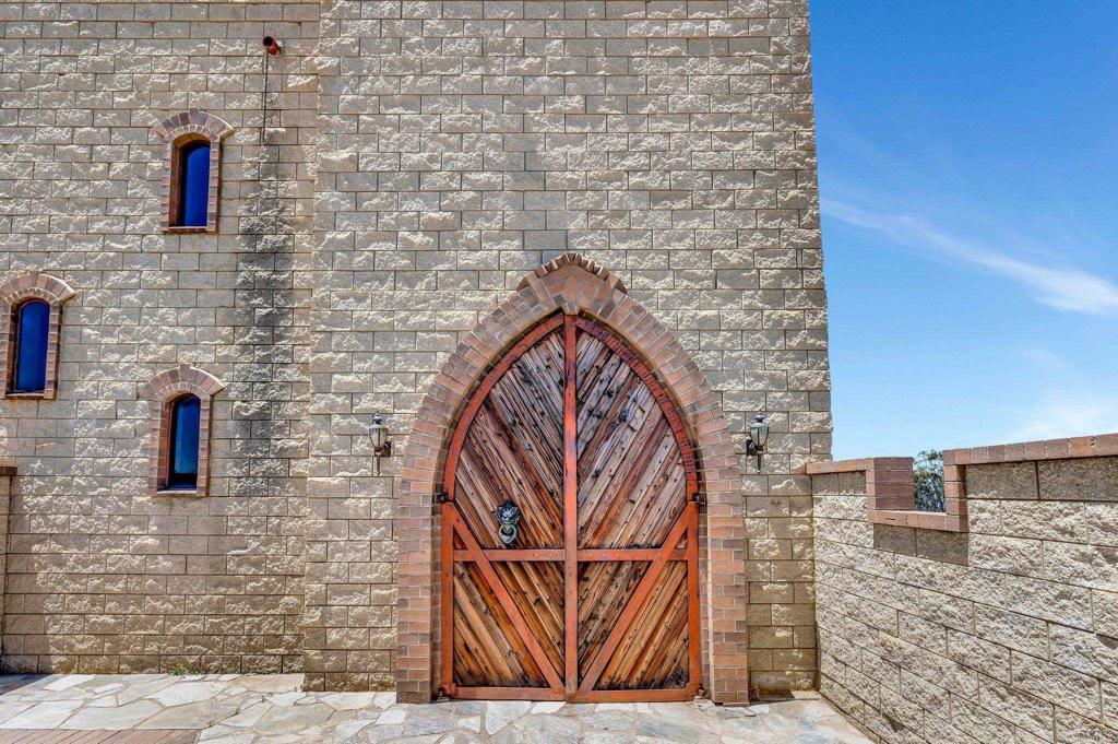 19105 Laminack Lane Jamul, CA 91935 - Photo 4 of 27 a brick building with a street sign on the wall