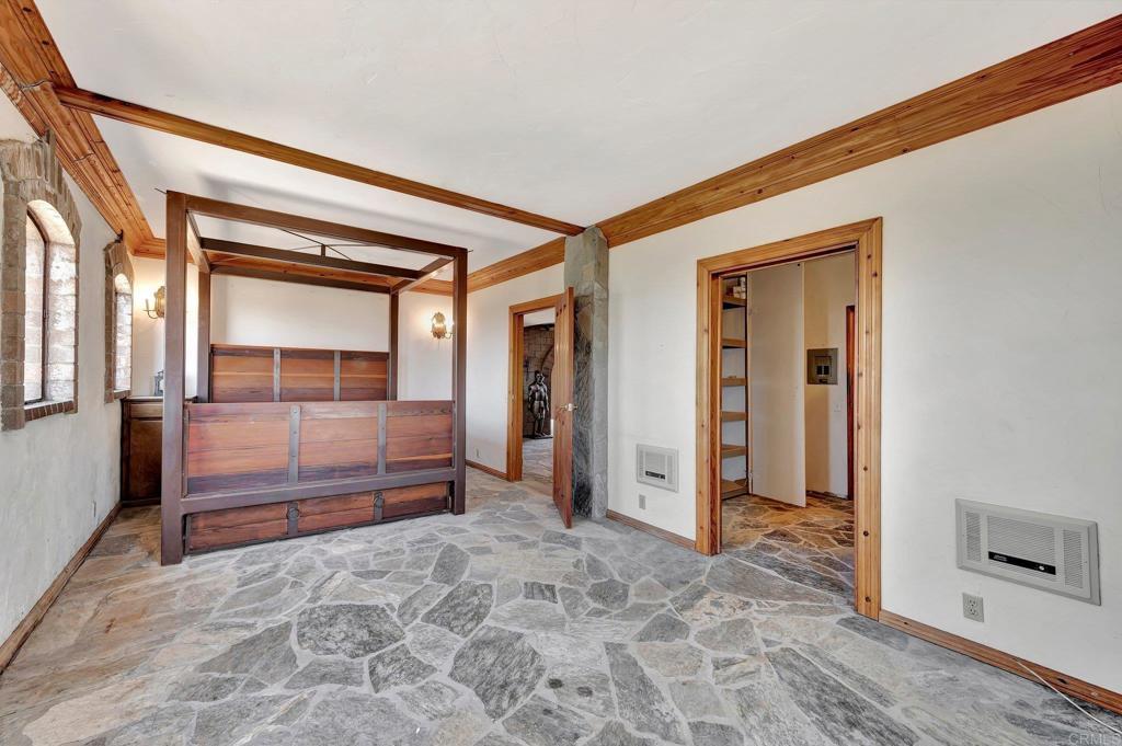 19105 Laminack Lane Jamul, CA 91935 - Photo 10 of 27 a view of a hallway with wooden floor and windows