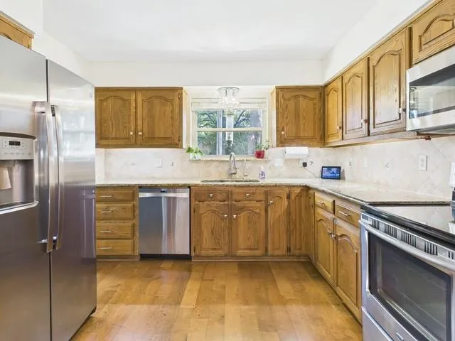 a bedroom with a bed and a mirror