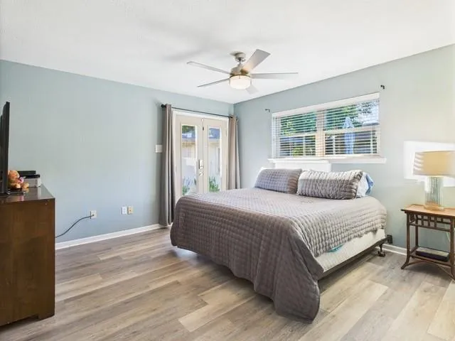 a bedroom with a bed and a chair