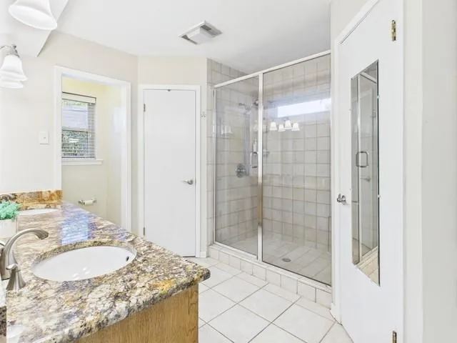 a view of brick house with a yard