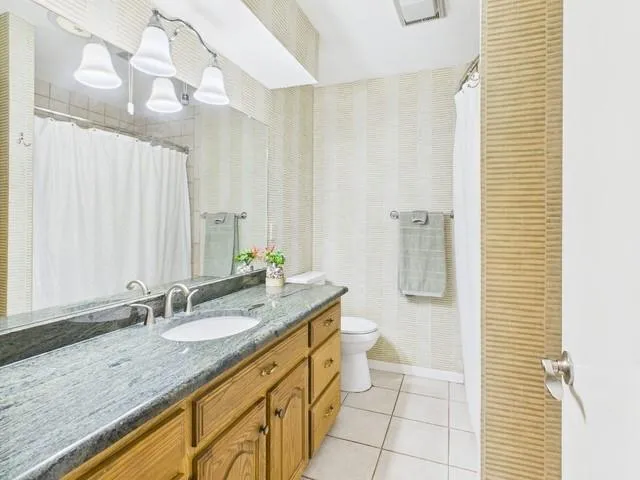 a kitchen with cabinets appliances and a window