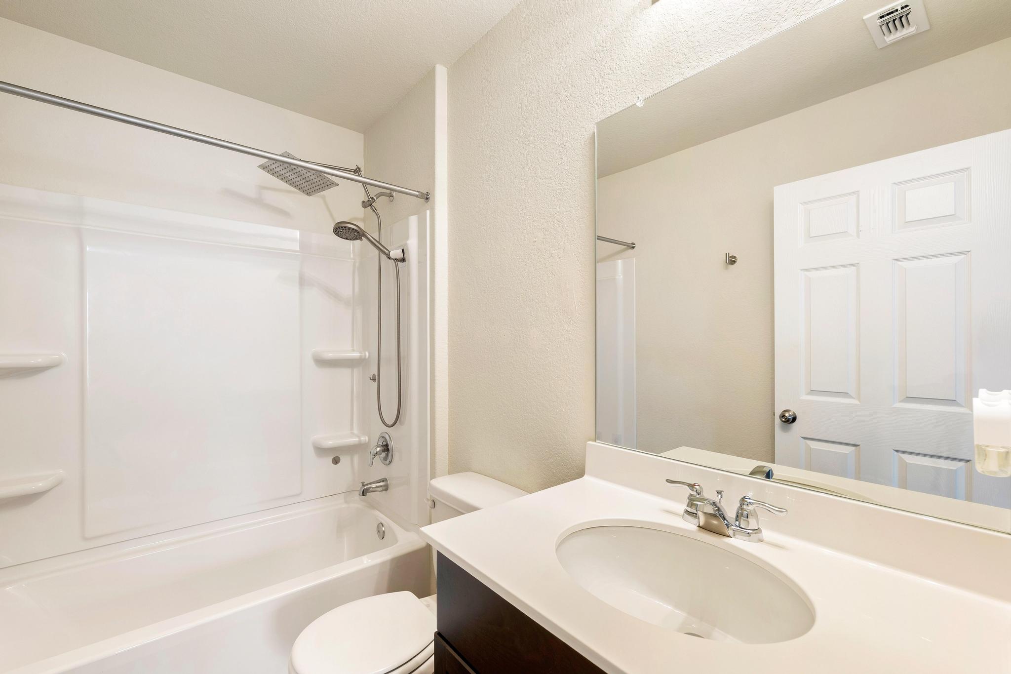 217 Innisfree Road Jarrell, TX 76537 - Photo 30 of 39 A well-appointed bathroom features a bathtub-shower combination and a clean, single vanity.