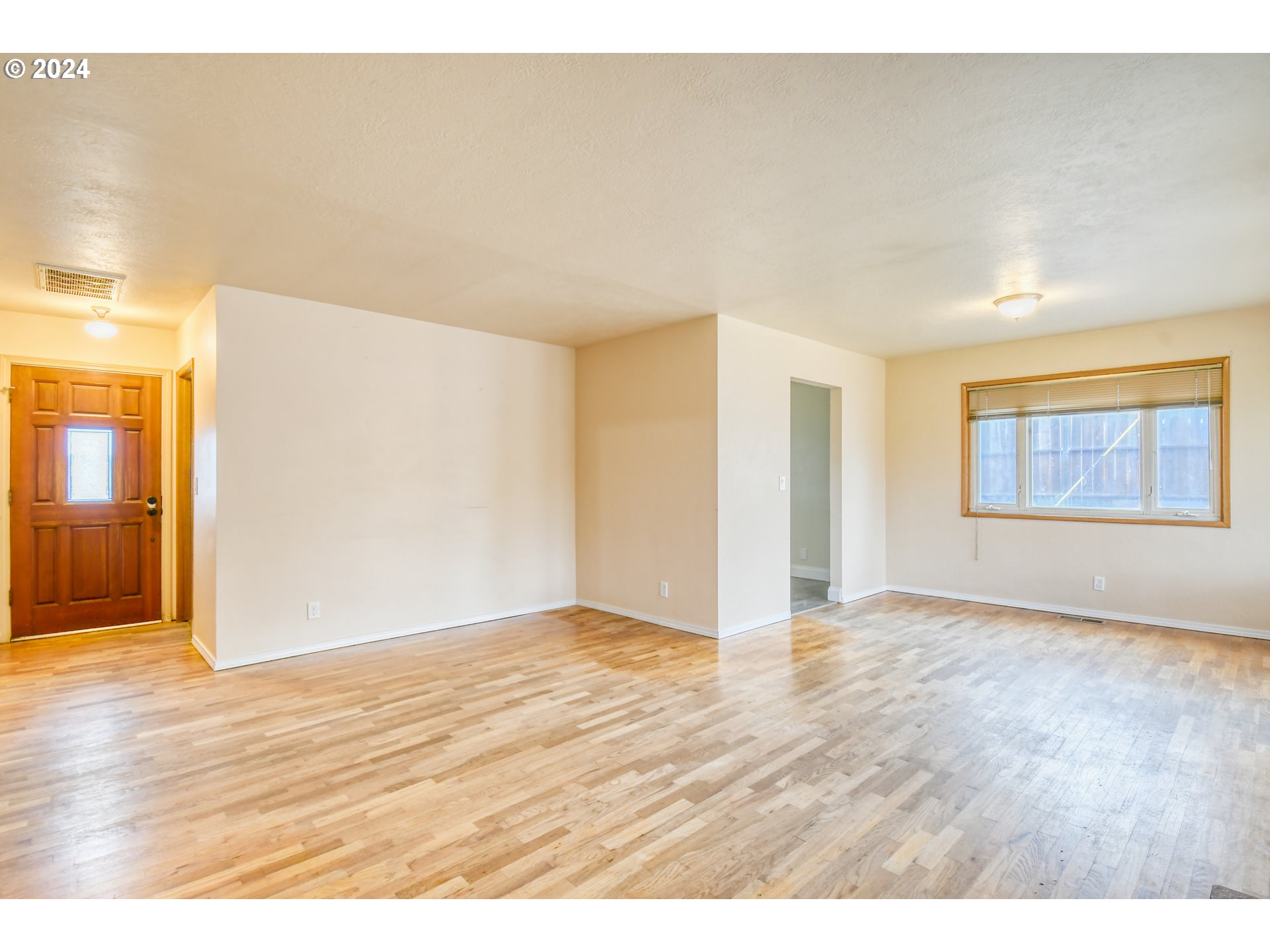 3222 Southwest Hailey Place Pendleton, OR 97801 - Photo 11 of 48 a view of an empty room with window and wooden floor