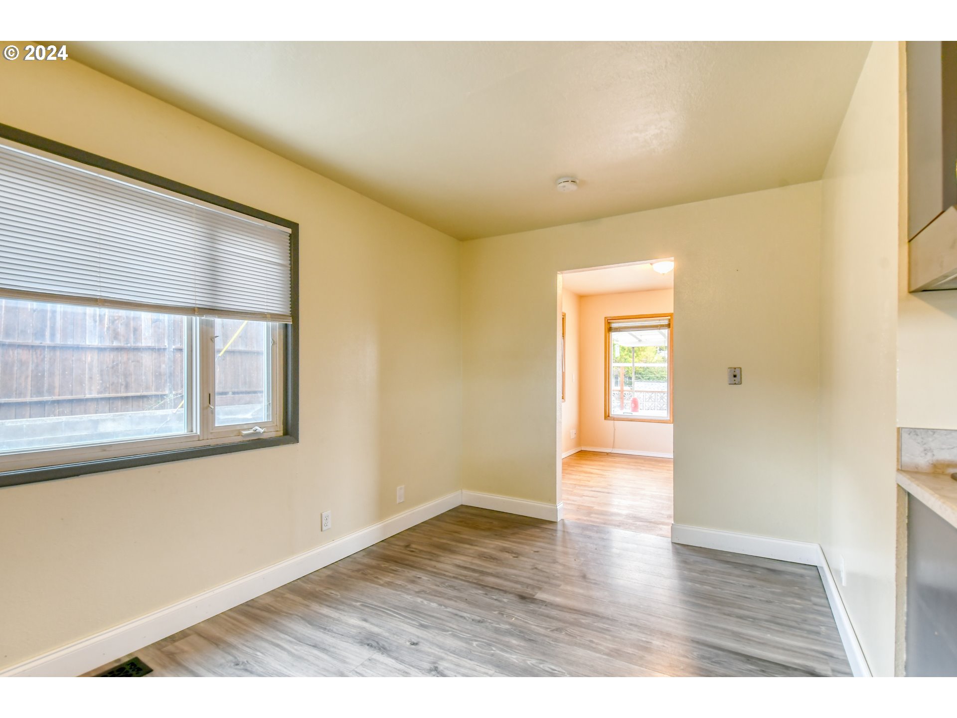 3222 Southwest Hailey Place Pendleton, OR 97801 - Photo 21 of 48 a view of an empty room with wooden floor and a window