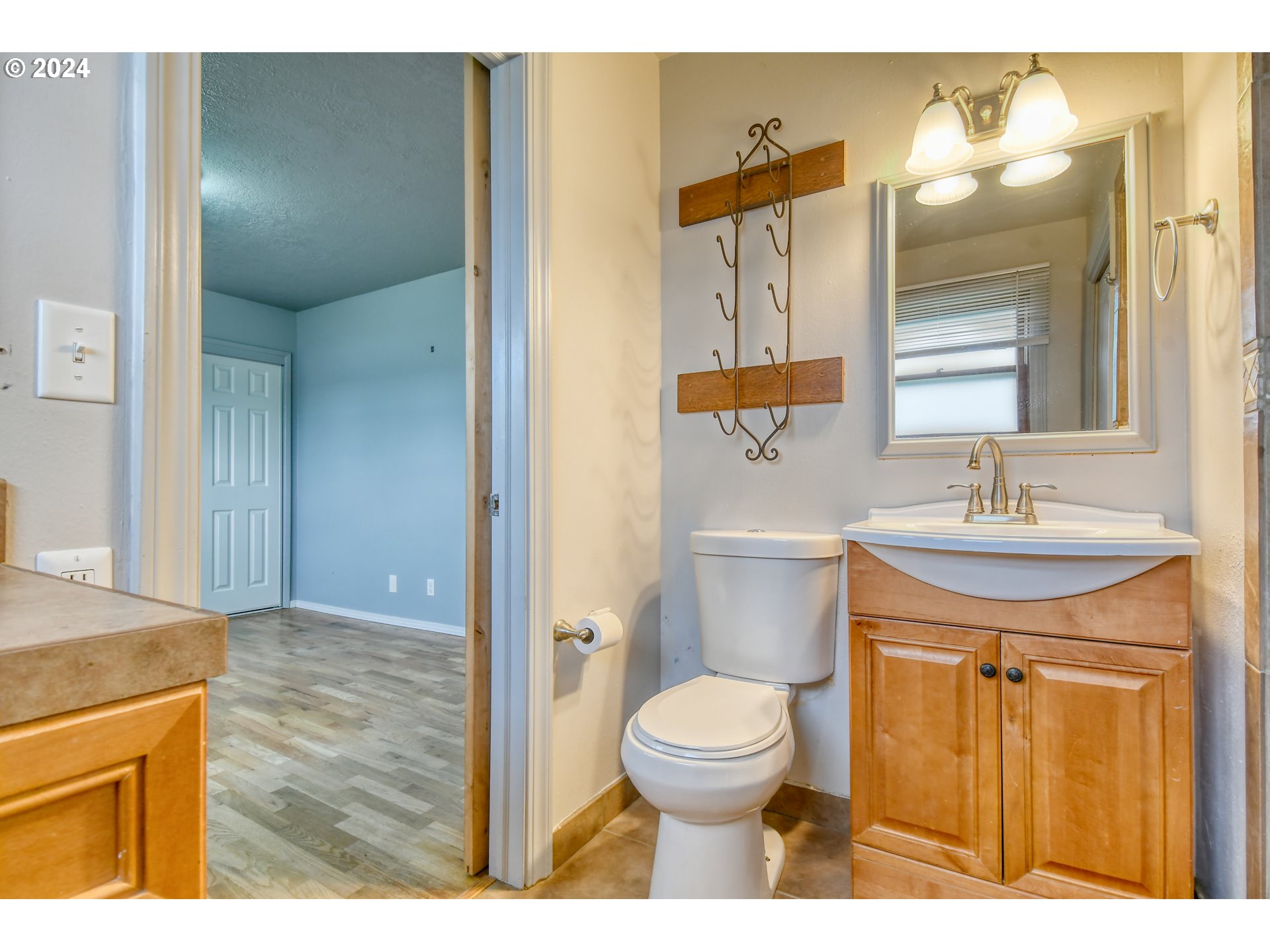 3222 Southwest Hailey Place Pendleton, OR 97801 - Photo 28 of 48 a bathroom with a sink a toilet and mirror