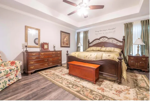 a bedroom with a bed and a dresser