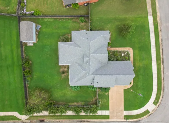 a view of a house with a sink yard and a lake view