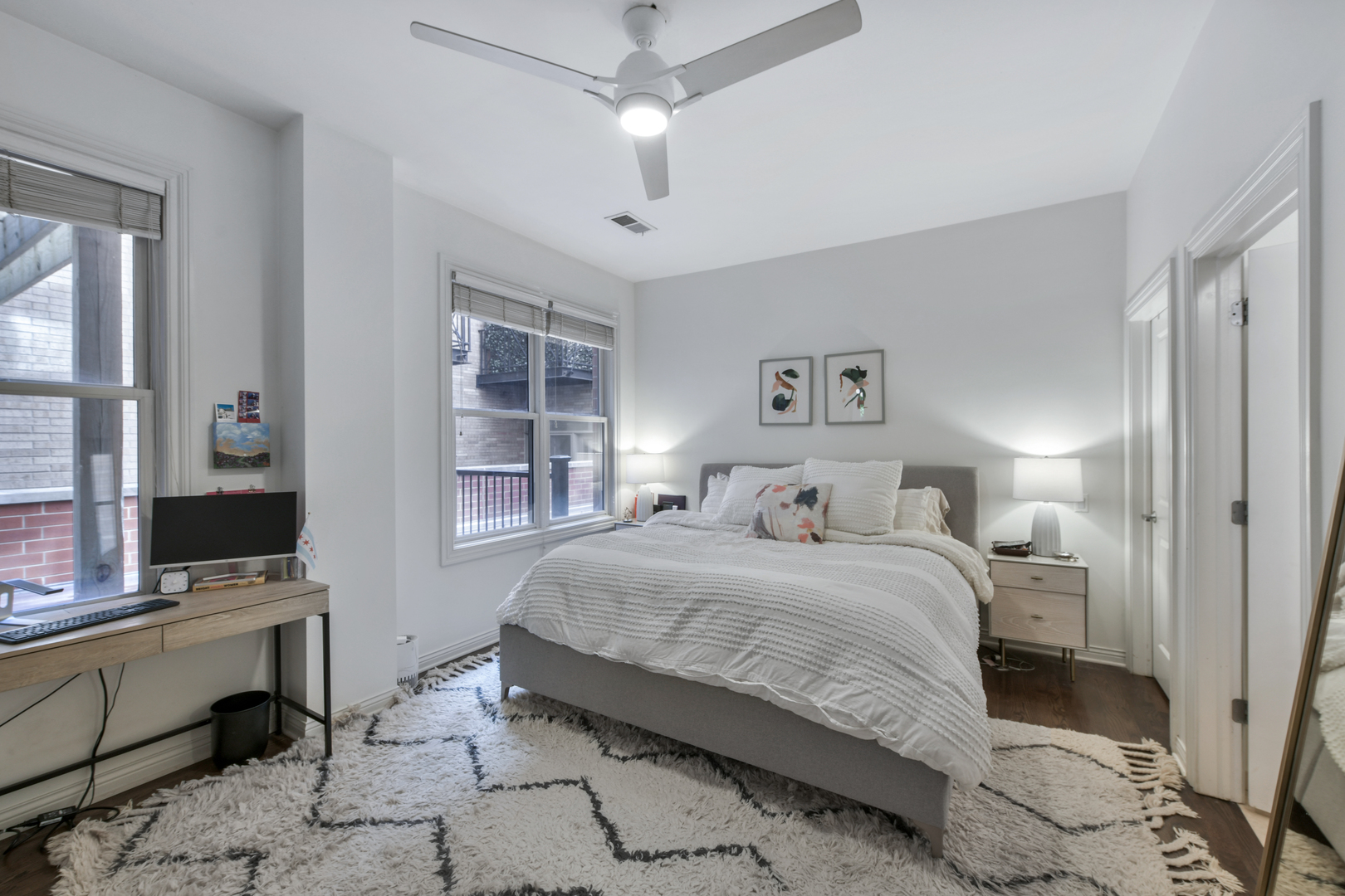 1355 West Washington Boulevard, Unit 2B Chicago, IL 60607 - Photo 9 of 16 a bedroom with a bed and a desk