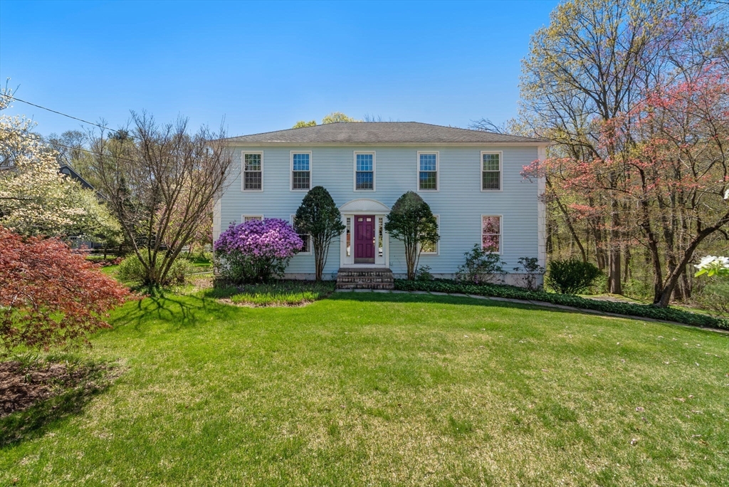 16 Parmenter Road Framingham, MA 01701 - Photo 1 of 34 a front view of house with yard and trees
