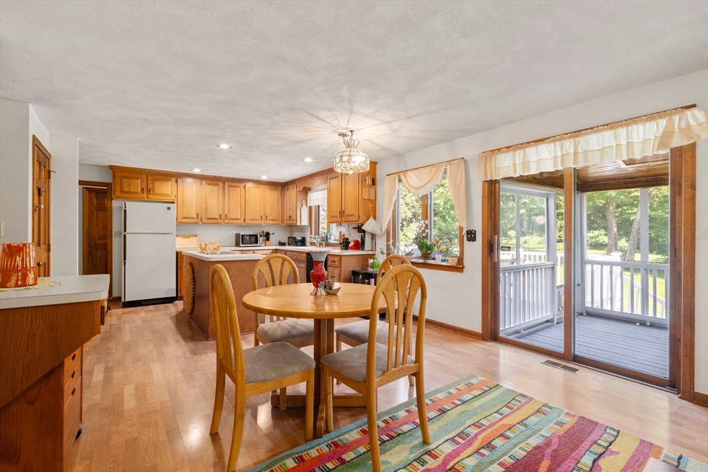 16 Parmenter Road Framingham, MA 01701 - Photo 11 of 34 a view of a dining room with furniture window and wooden floor
