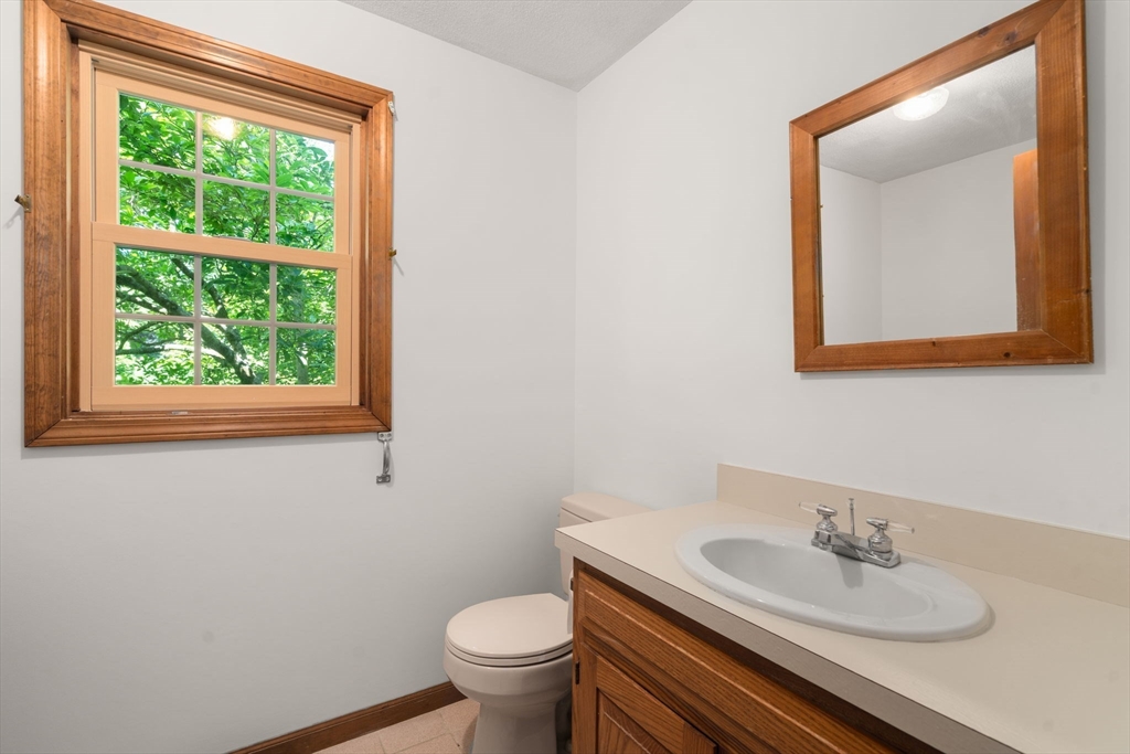 16 Parmenter Road Framingham, MA 01701 - Photo 12 of 34 a bathroom with a sink and a mirror