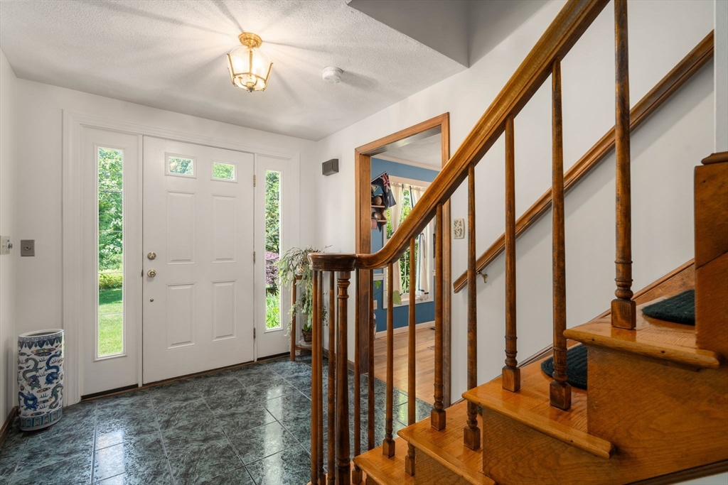 16 Parmenter Road Framingham, MA 01701 - Photo 13 of 34 a view of an entryway with wooden floor and stairs