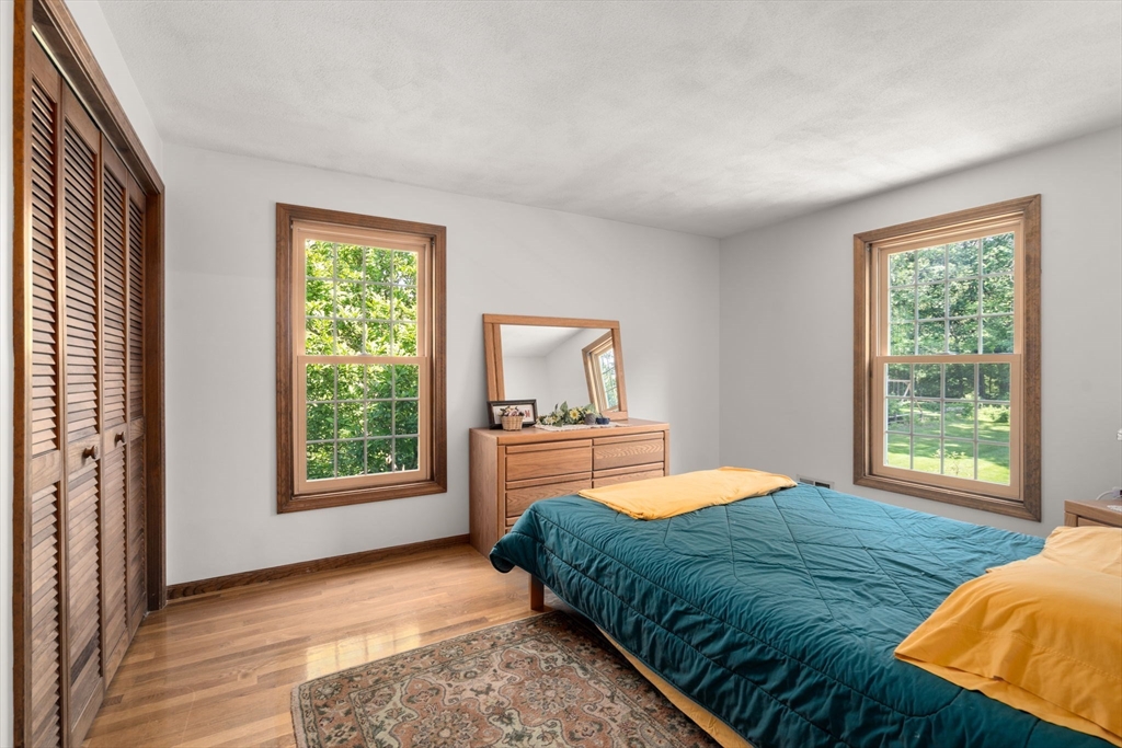 16 Parmenter Road Framingham, MA 01701 - Photo 19 of 34 a bedroom with a bed and a window