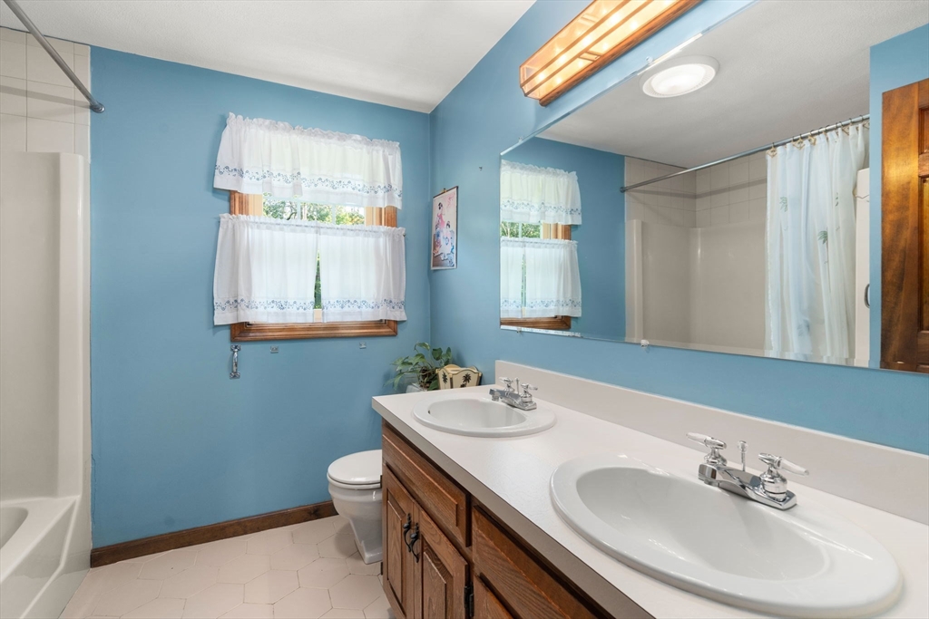 16 Parmenter Road Framingham, MA 01701 - Photo 20 of 34 a bathroom with a sink and a mirror