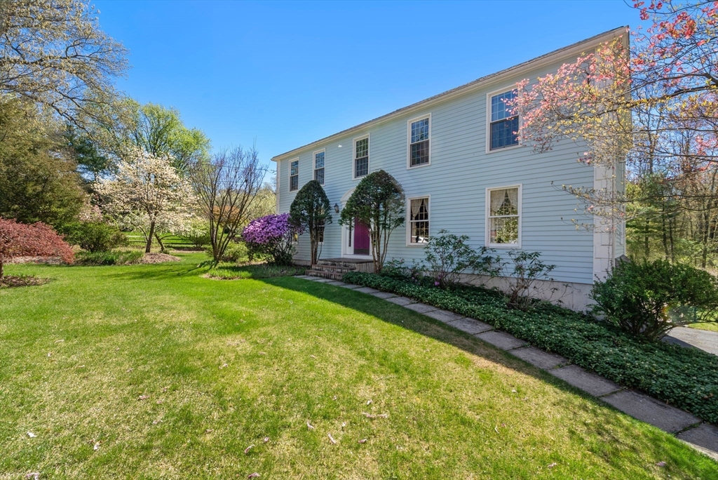 16 Parmenter Road Framingham, MA 01701 - Photo 2 of 34 a front view of house with yard and green space