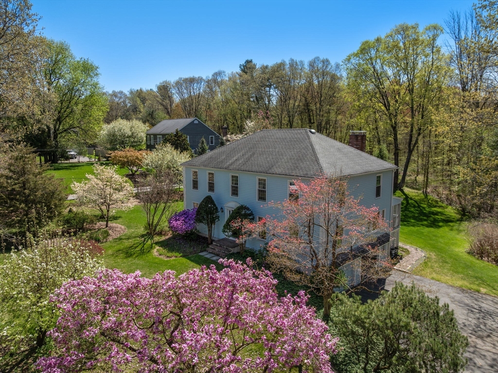 16 Parmenter Road Framingham, MA 01701 - Photo 3 of 34 a view of house with garden and tall trees