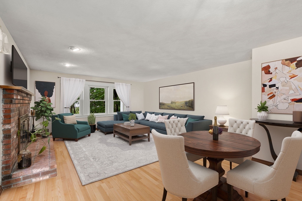 16 Parmenter Road Framingham, MA 01701 - Photo 6 of 34 a living room with furniture potted plant and a table