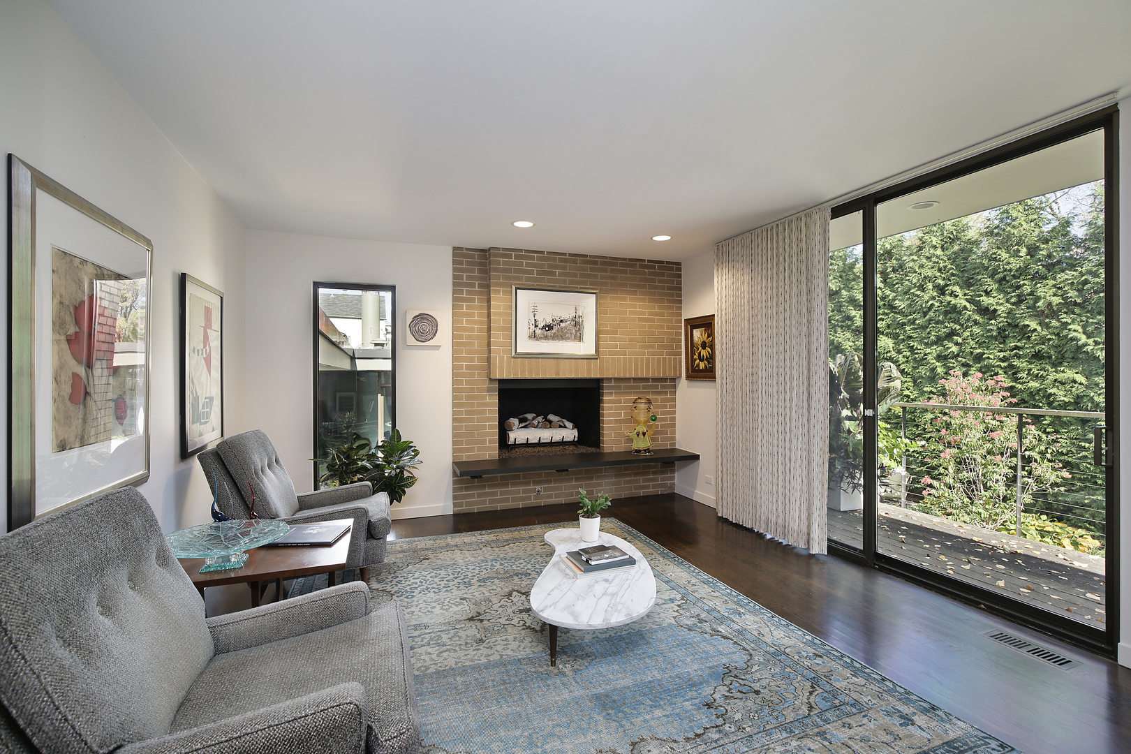 643 Sheridan Road Evanston, IL 60202 - Photo 16 of 29 a living room with furniture and a fireplace