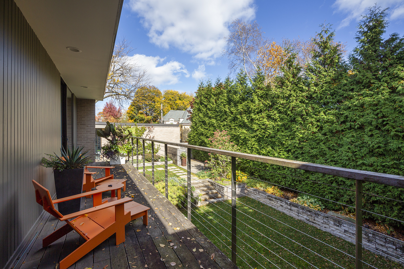 643 Sheridan Road Evanston, IL 60202 - Photo 17 of 29 a balcony with wooden floor and potted plants