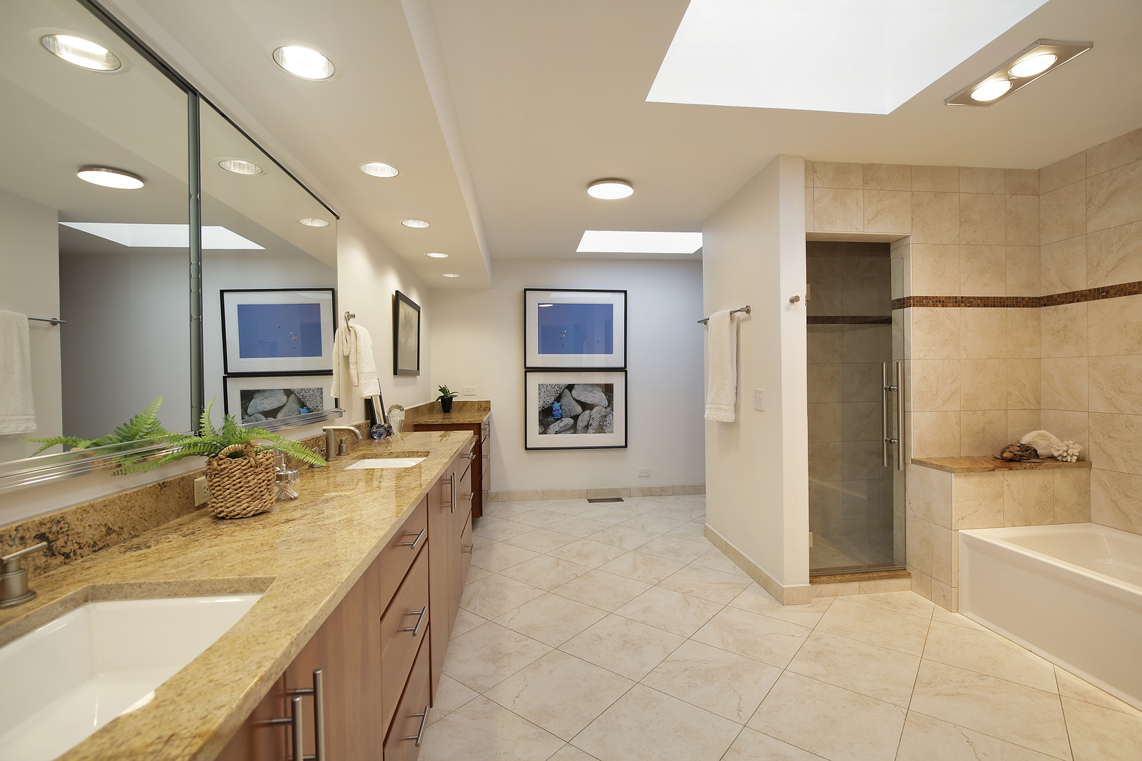 643 Sheridan Road Evanston, IL 60202 - Photo 18 of 29 a spacious bathroom with a granite countertop sink a mirror a bathtub and shower