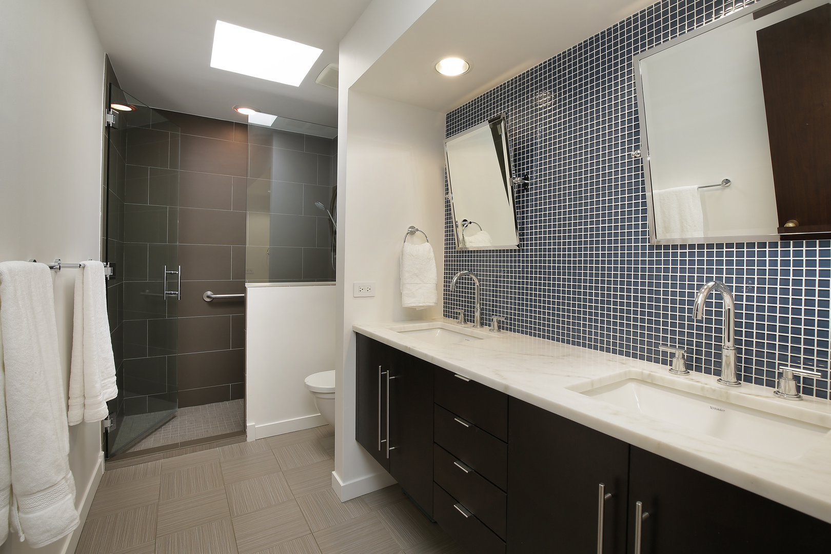 643 Sheridan Road Evanston, IL 60202 - Photo 20 of 29 a bathroom with a double vanity sink toilet and shower