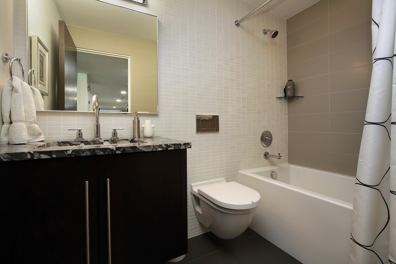 643 Sheridan Road Evanston, IL 60202 - Photo 25 of 29 a bathroom with a granite countertop sink toilet and shower