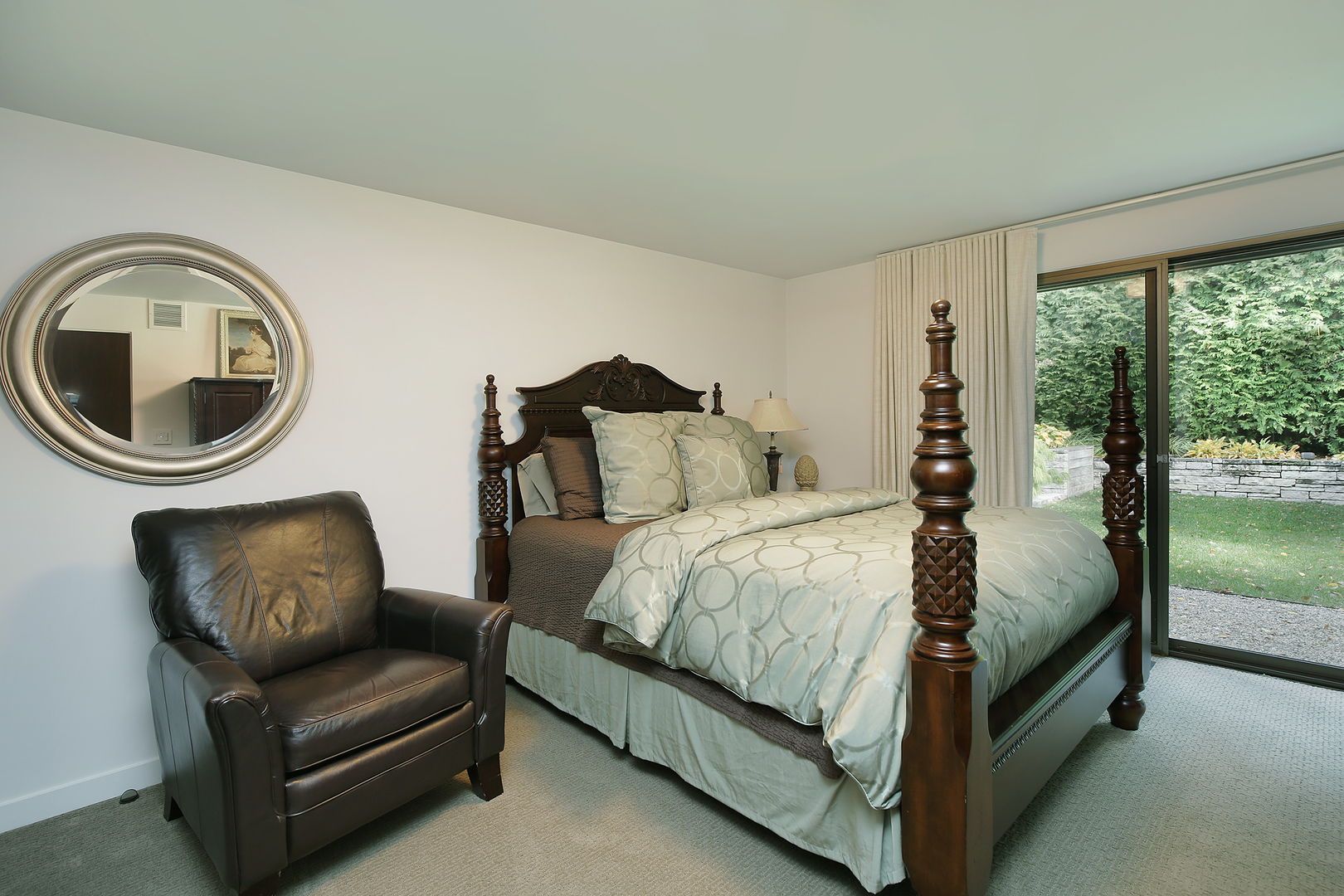 643 Sheridan Road Evanston, IL 60202 - Photo 26 of 29 a bedroom with a bed a couch and a large window