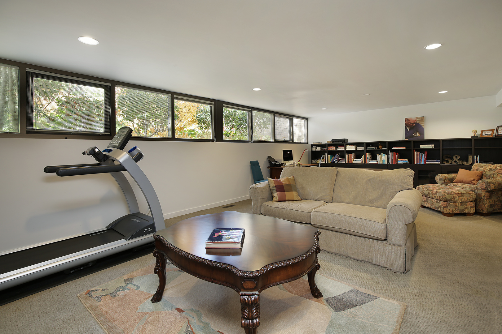643 Sheridan Road Evanston, IL 60202 - Photo 27 of 29 a living room with furniture a window and gym equipment