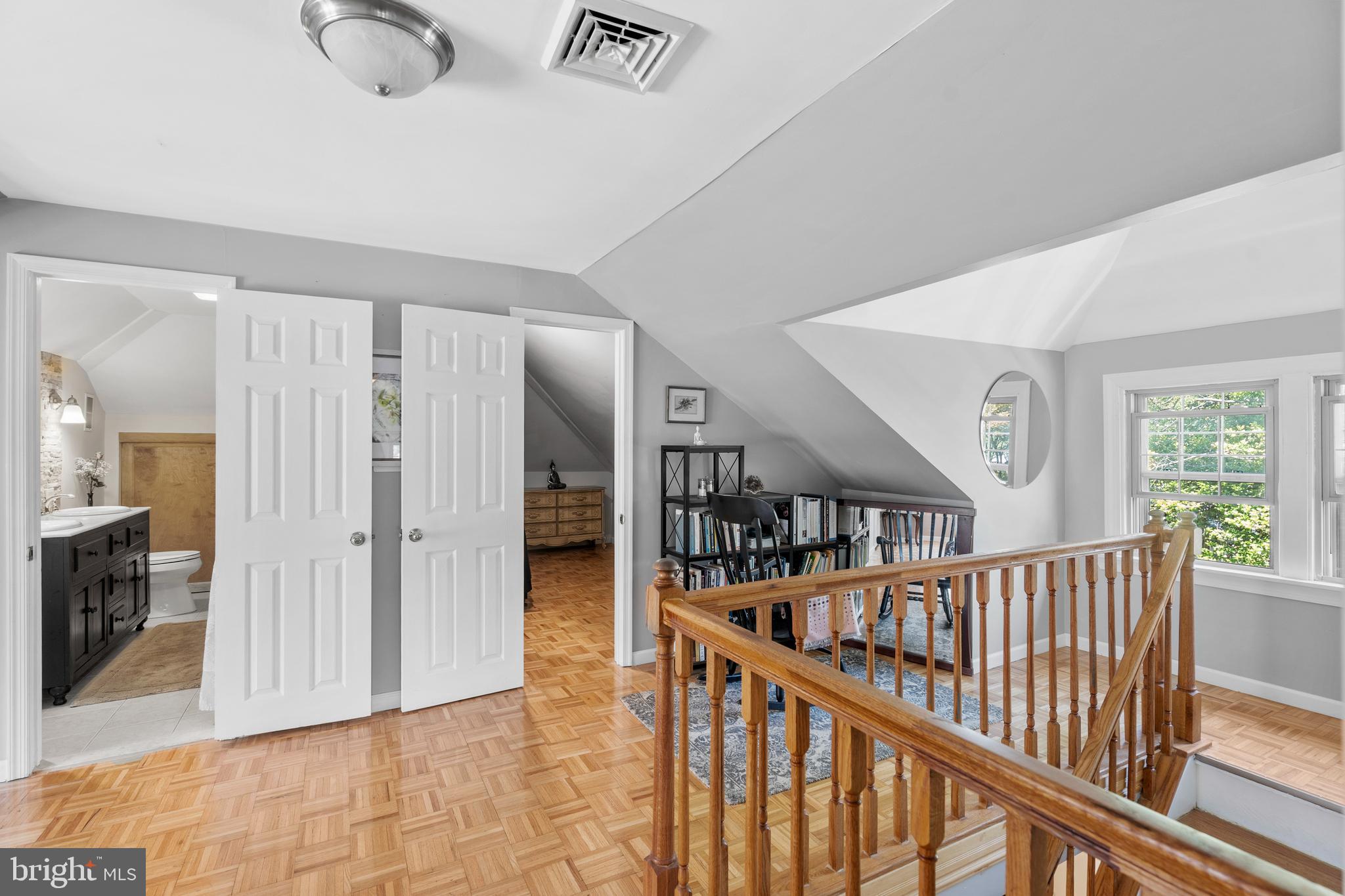 1118 Allston Road Havertown, PA 19083 - Photo 44 of 58 a view of staircase with lots of frames on wall and a window
