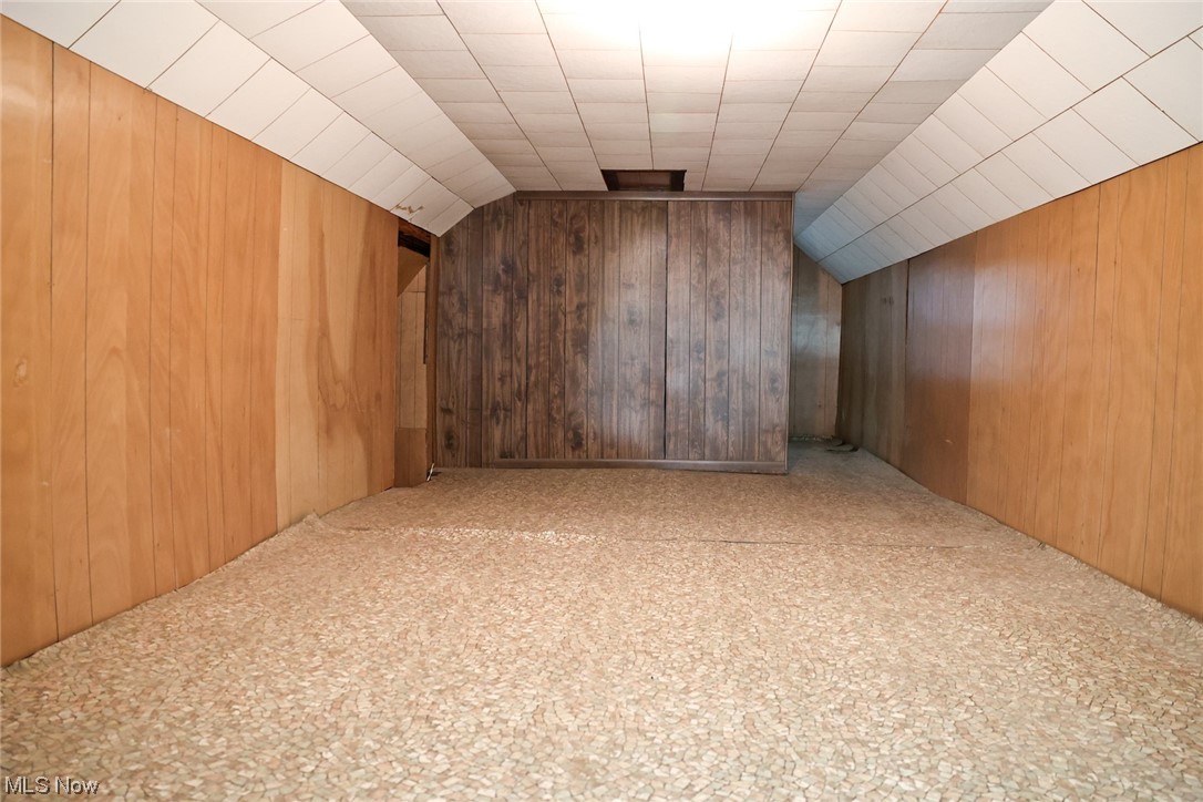 1309 Krumroy Road Akron, OH 44306 - Photo 20 of 30 Additional living space featuring wooden walls and lofted ceiling