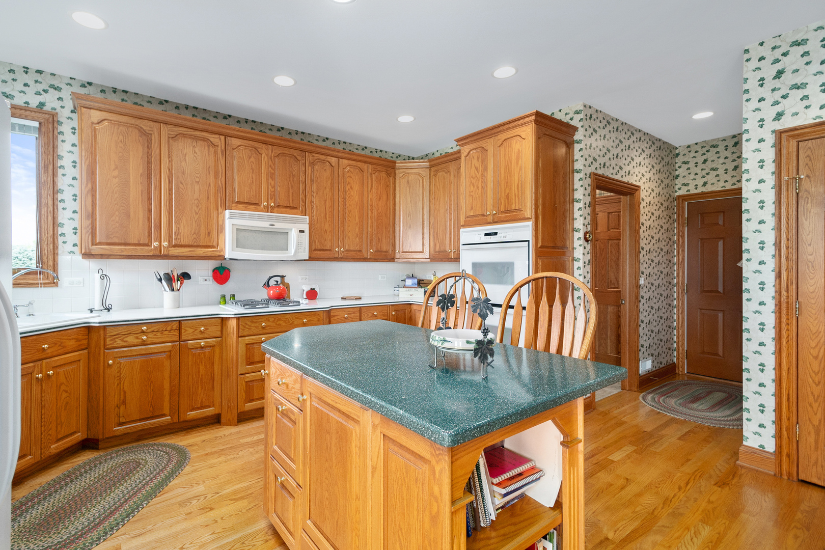 42W545 McDonald Road Elgin, IL 60124 - Photo 13 of 45 a kitchen with stainless steel appliances granite countertop a sink a stove cabinets counter space and a window