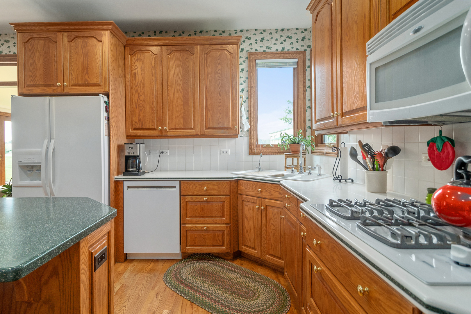 42W545 McDonald Road Elgin, IL 60124 - Photo 16 of 45 a kitchen with stainless steel appliances granite countertop a sink stove and refrigerator