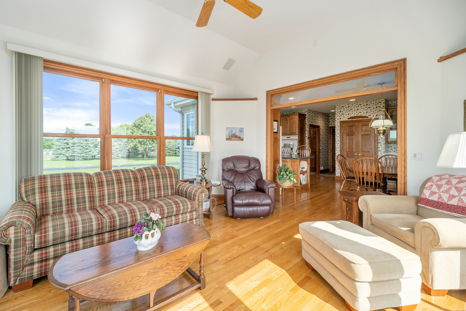 42W545 McDonald Road Elgin, IL 60124 - Photo 20 of 45 a living room with furniture and a floor to ceiling window