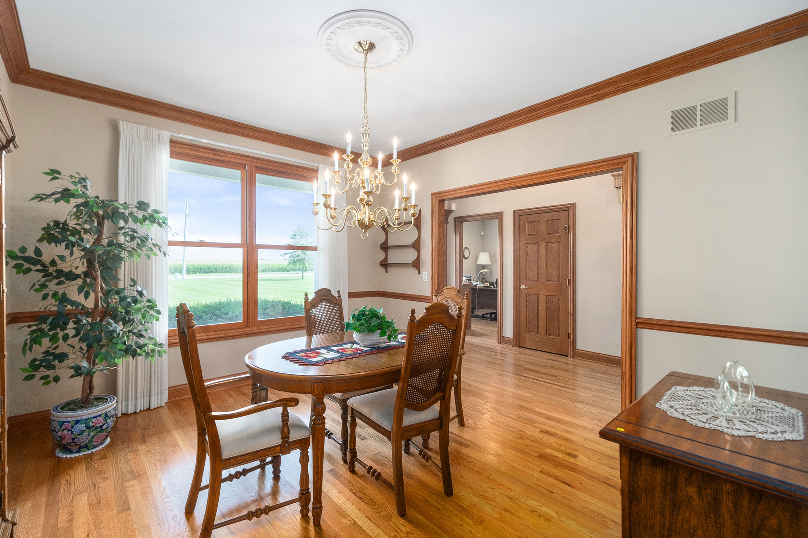 42W545 McDonald Road Elgin, IL 60124 - Photo 6 of 45 a view of a dining room with furniture window and wooden floor