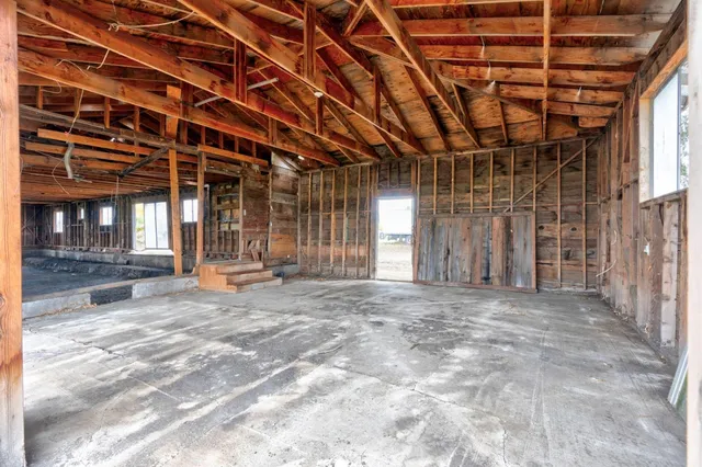 a view of a building with stairs and a yard