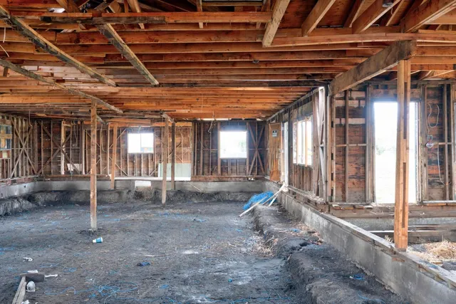 a view of a room with wooden ceiling