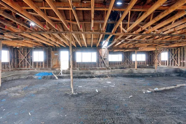 a view of a room with wooden walls