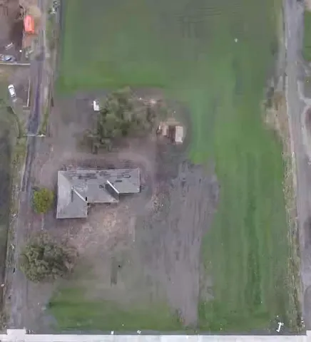 a view of house with a yard