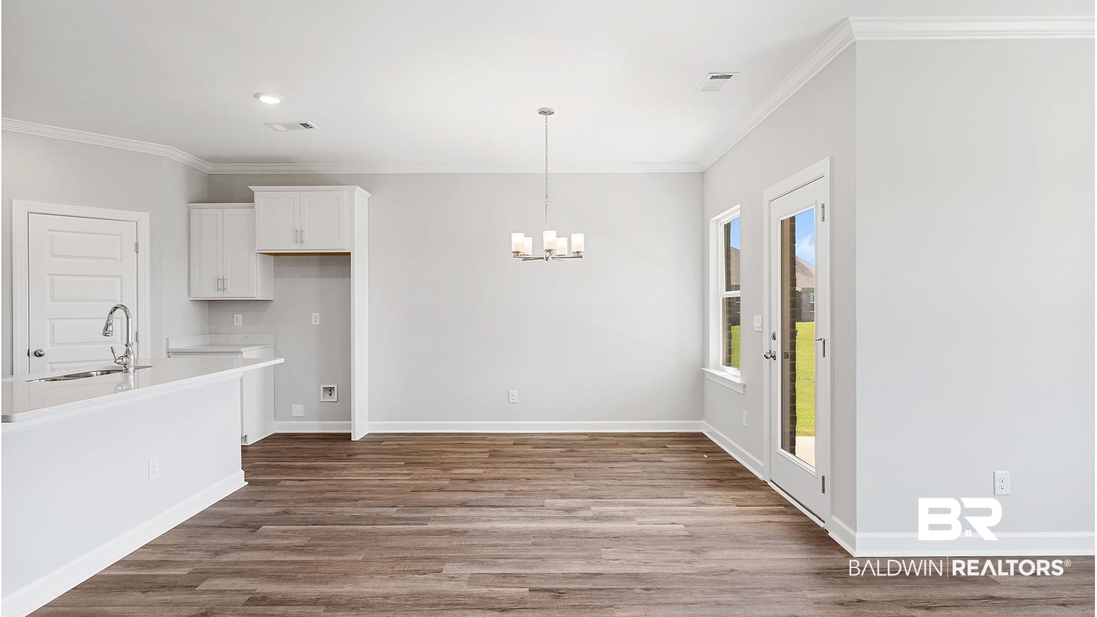 30567 Asheville Road Daphne, AL 36527 - Photo 7 of 29 Unfurnished dining area featuring crown molding, dark wood finished floors, a chandelier, and recessed lighting